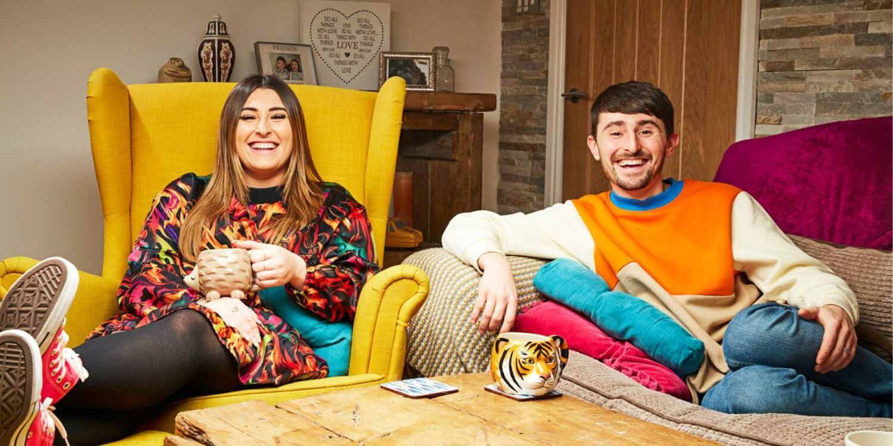 Gogglebox stars Pete and Sophie sat on chair and sofa in living room